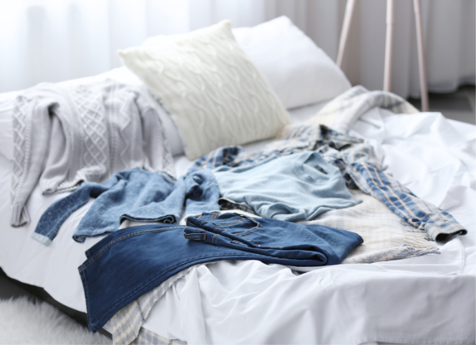 Clothes on a bed.